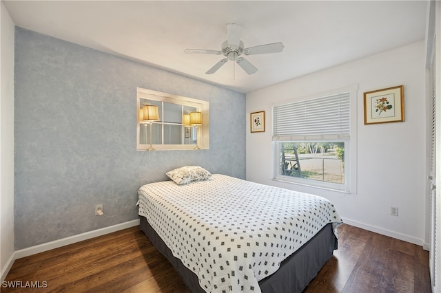 bedroom featuring dark wood-type flooring and ceiling fan