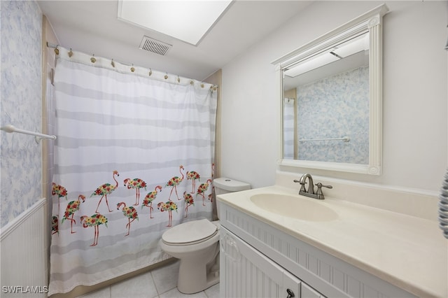 bathroom featuring vanity, toilet, a shower with curtain, and tile patterned flooring