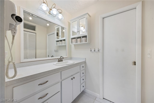 bathroom featuring vanity and tile patterned floors