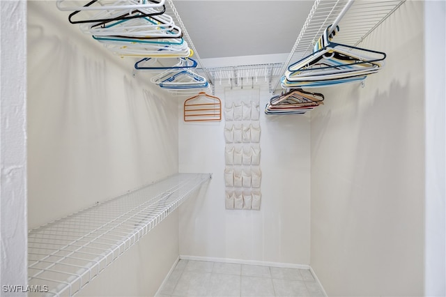 walk in closet featuring light tile patterned floors