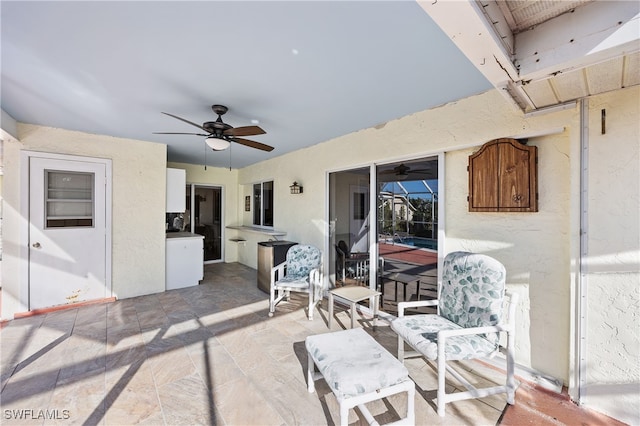 view of patio with ceiling fan