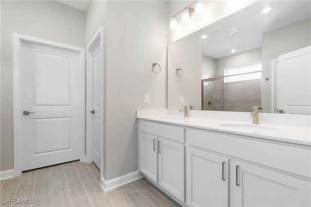 bathroom featuring vanity and walk in shower