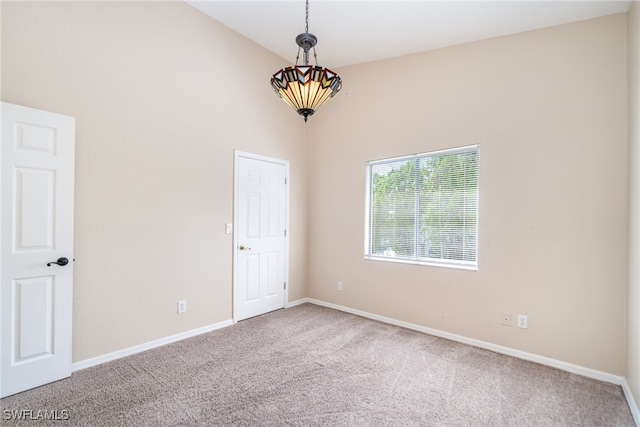 unfurnished room with carpet flooring