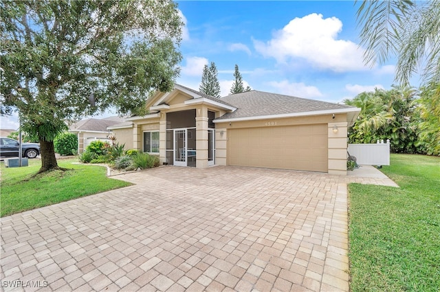 view of front facade with a front lawn and a garage