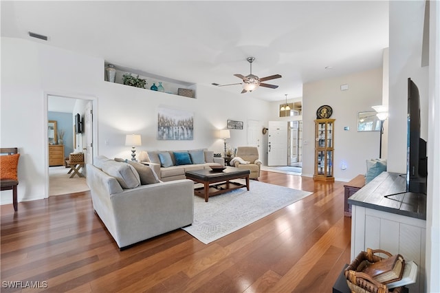 living room with hardwood / wood-style floors and ceiling fan