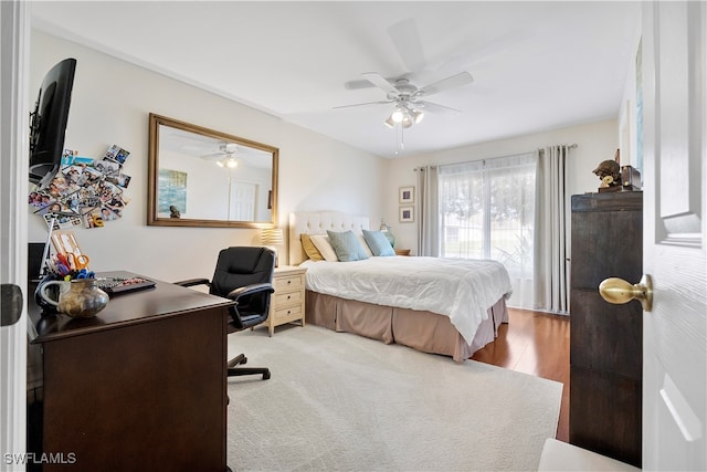 bedroom with ceiling fan and wood-type flooring