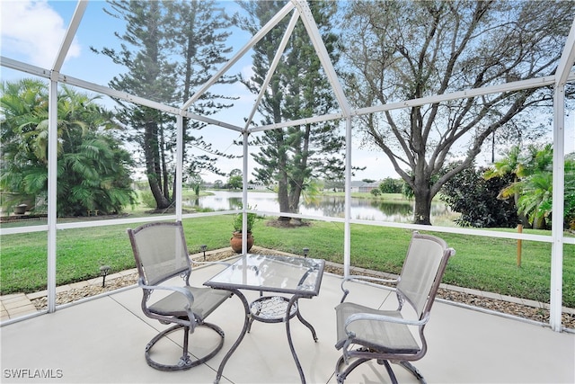 unfurnished sunroom with a water view