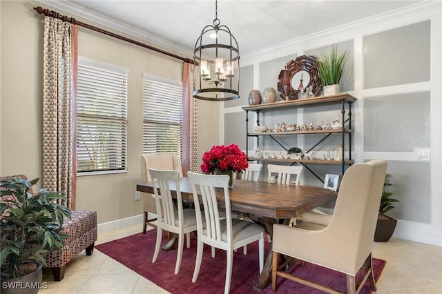 dining area featuring ornamental molding, light tile patterned floors, and a chandelier