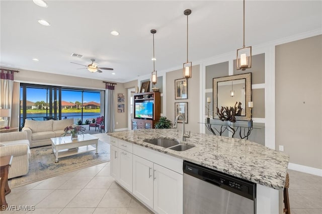 kitchen with sink, white cabinets, ceiling fan, stainless steel dishwasher, and a center island with sink