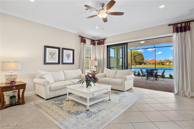 living room with ceiling fan, ornamental molding, light tile patterned floors, and a water view