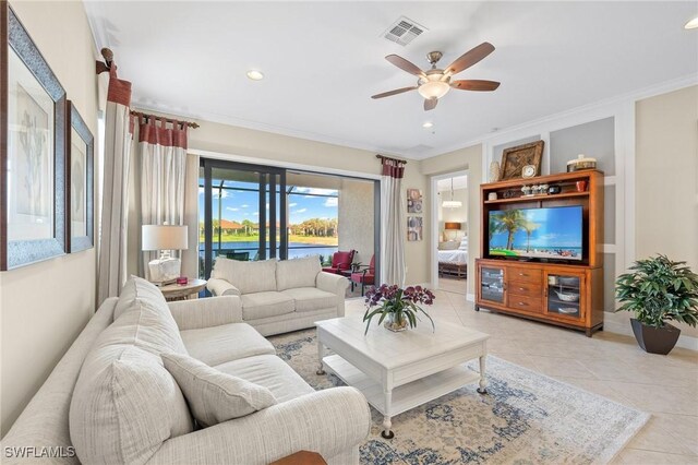 tiled living room with ceiling fan and ornamental molding