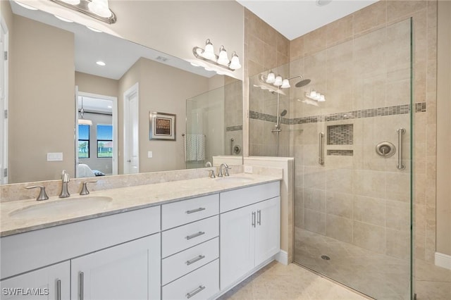 bathroom featuring vanity, an enclosed shower, and tile patterned flooring