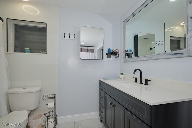 bathroom featuring toilet and vanity