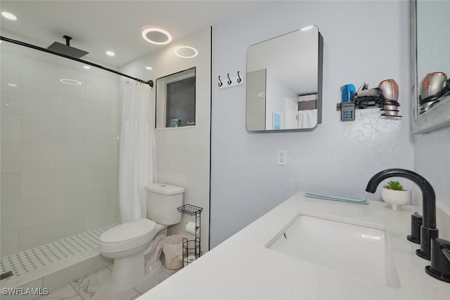 bathroom featuring vanity, a shower with curtain, and toilet