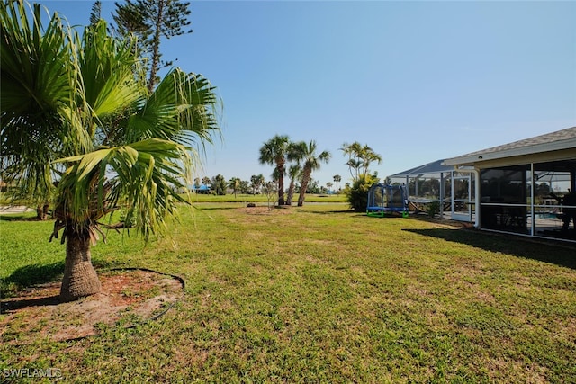 view of yard featuring a sunroom