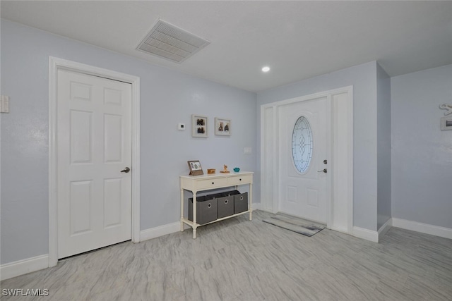 foyer with light hardwood / wood-style floors