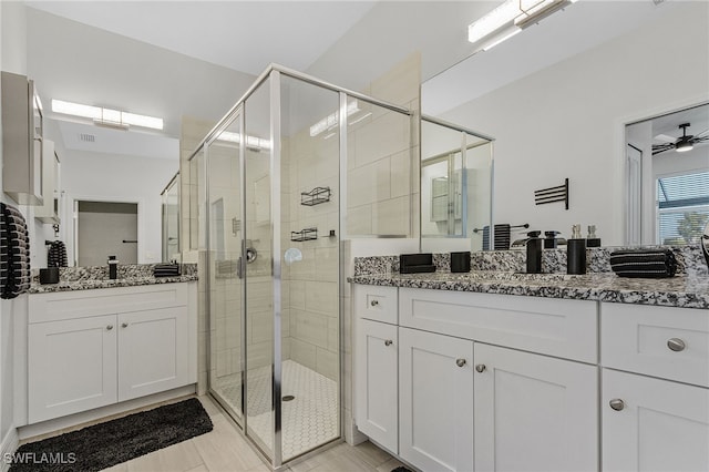 bathroom featuring vanity, walk in shower, and ceiling fan