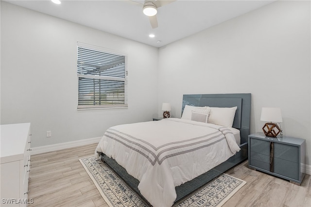 bedroom with ceiling fan and light wood-type flooring