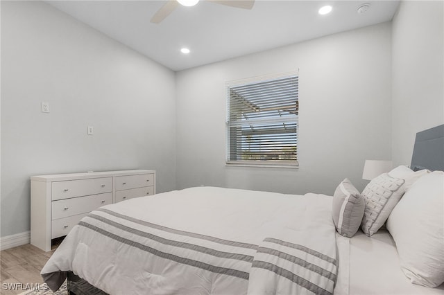 bedroom with ceiling fan and light wood-type flooring