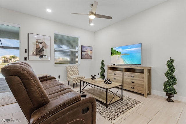 tiled living room featuring ceiling fan and a healthy amount of sunlight