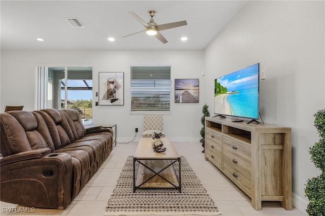 tiled living room with ceiling fan