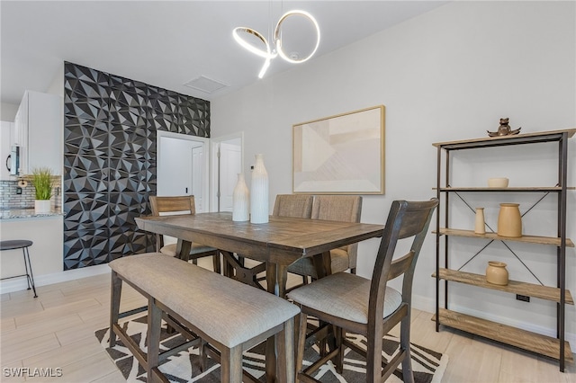 dining space with light wood-type flooring