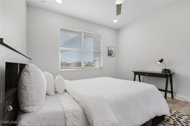 bedroom with hardwood / wood-style flooring and ceiling fan