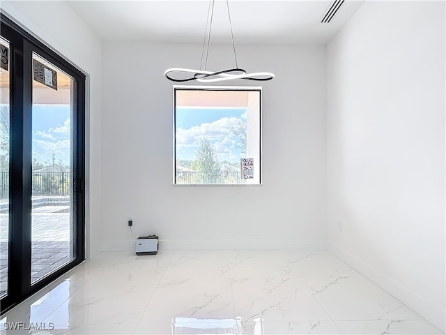 unfurnished dining area with a healthy amount of sunlight