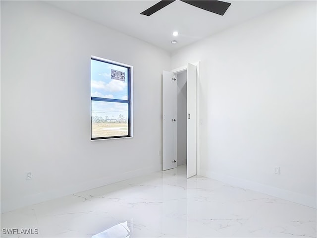 unfurnished room featuring ceiling fan