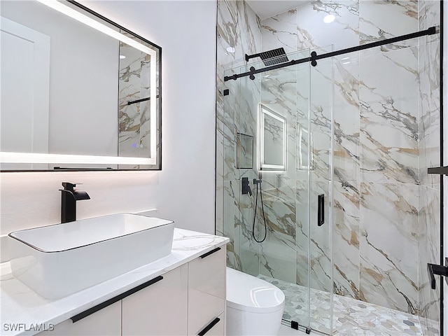 bathroom with vanity and a shower with shower door