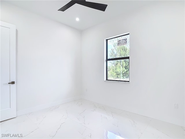 unfurnished room with ceiling fan