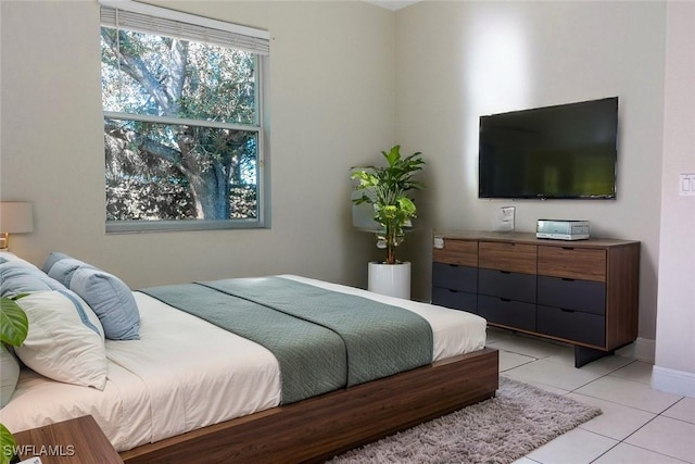 bedroom featuring light tile patterned flooring