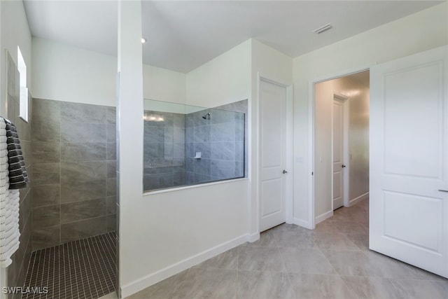 bathroom with tiled shower