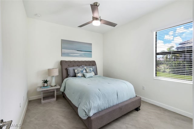 tiled bedroom with ceiling fan