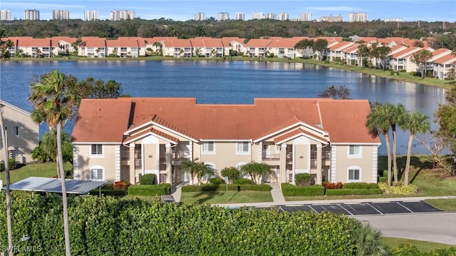 birds eye view of property featuring a water view