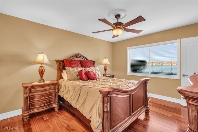 bedroom featuring hardwood / wood-style floors and ceiling fan