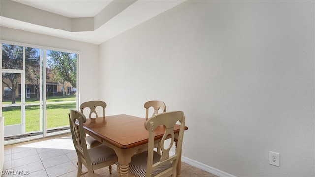 dining space with a healthy amount of sunlight and light tile patterned floors