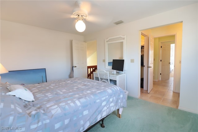 bedroom with light colored carpet and ceiling fan