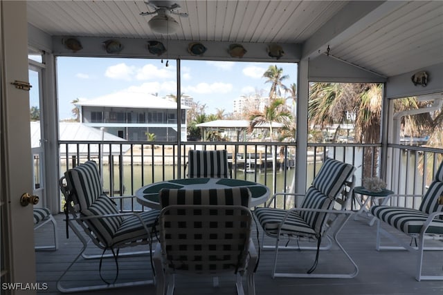 view of patio / terrace with a balcony, a water view, and ceiling fan