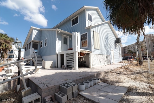 rear view of property with a patio area