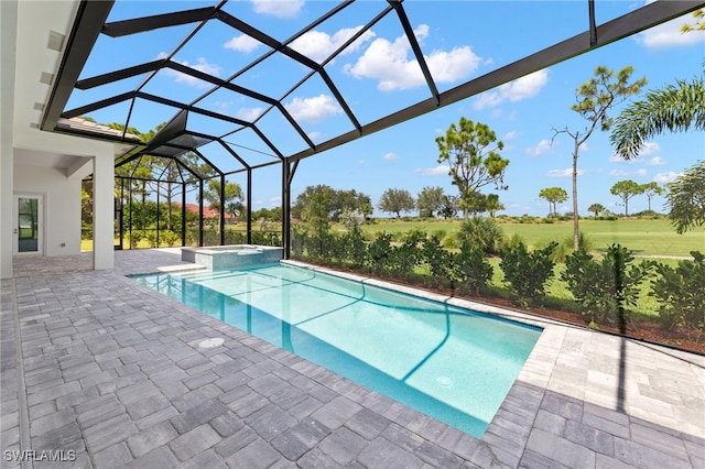 view of swimming pool with a patio area, a lanai, and an in ground hot tub