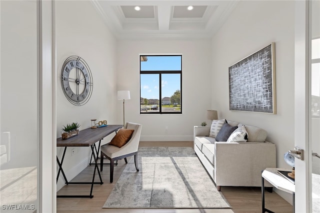 office space with wood-type flooring, crown molding, coffered ceiling, and beam ceiling