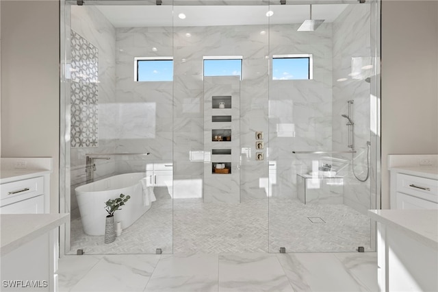 bathroom with vanity, plenty of natural light, and independent shower and bath