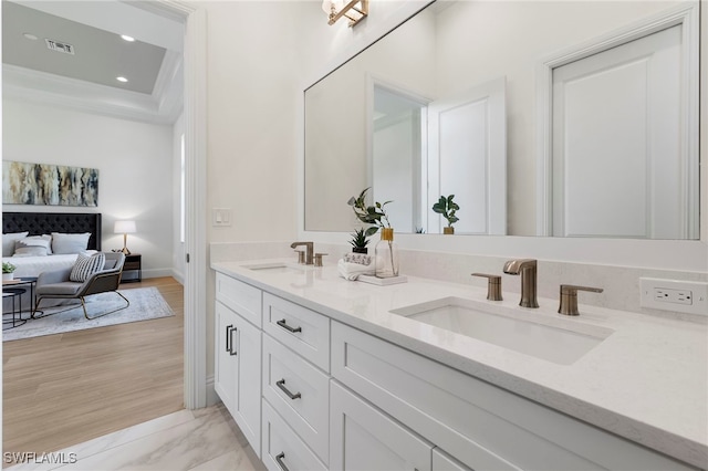 bathroom with hardwood / wood-style flooring and vanity