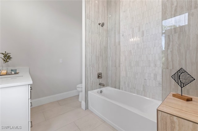 full bathroom with tile patterned flooring, vanity, toilet, and tiled shower / bath