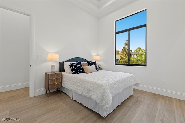 bedroom with light hardwood / wood-style floors