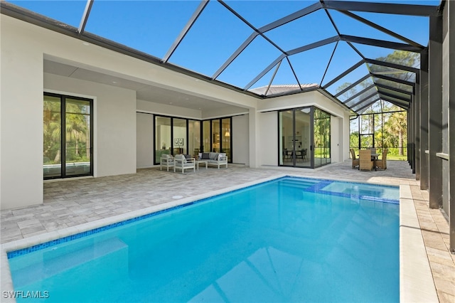 view of pool featuring an outdoor living space, a lanai, and a patio area