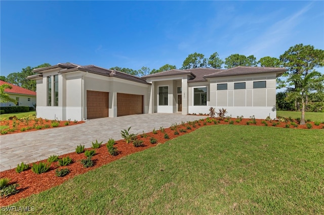 prairie-style house with a front lawn and a garage