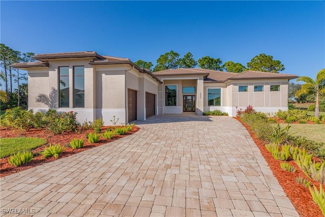 prairie-style house featuring a garage