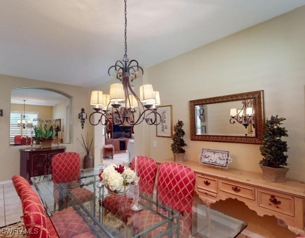 5291 Laurel Oak Ct, North Port, FL 34287 - dining room featuring an inviting chandelier and arched walkways